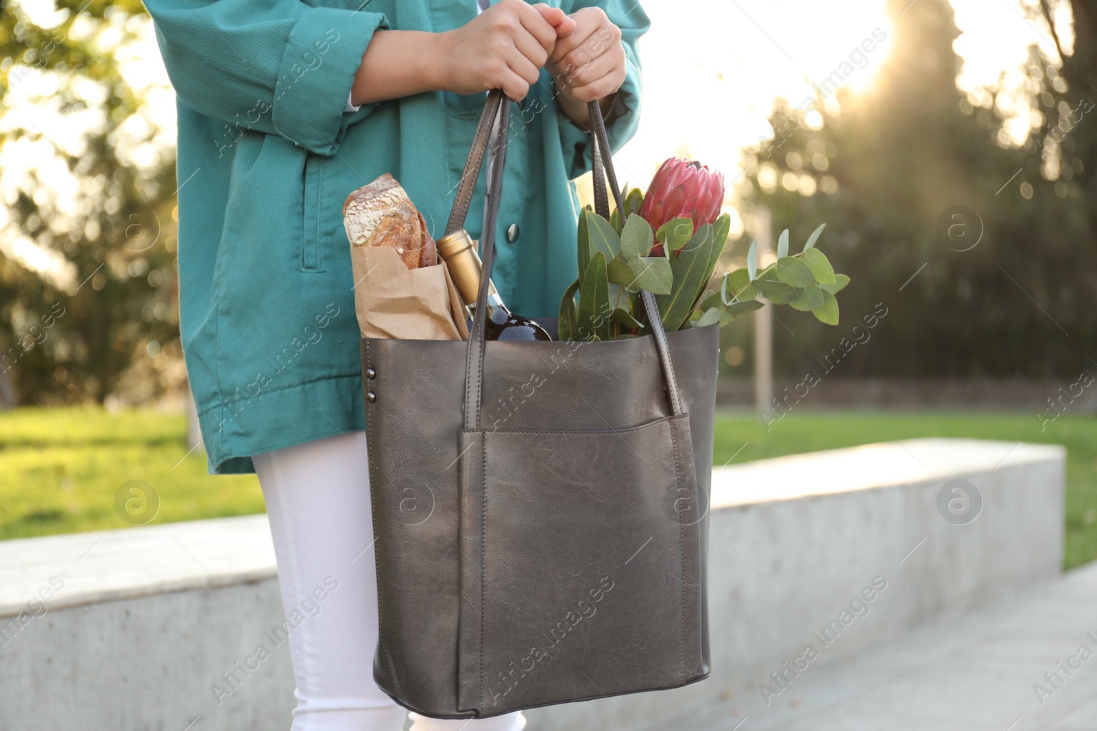 Photo of Woman with leather shopper bag outdoors, closeup