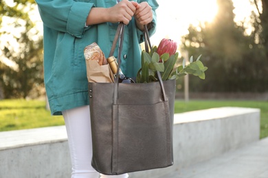 Photo of Woman with leather shopper bag outdoors, closeup