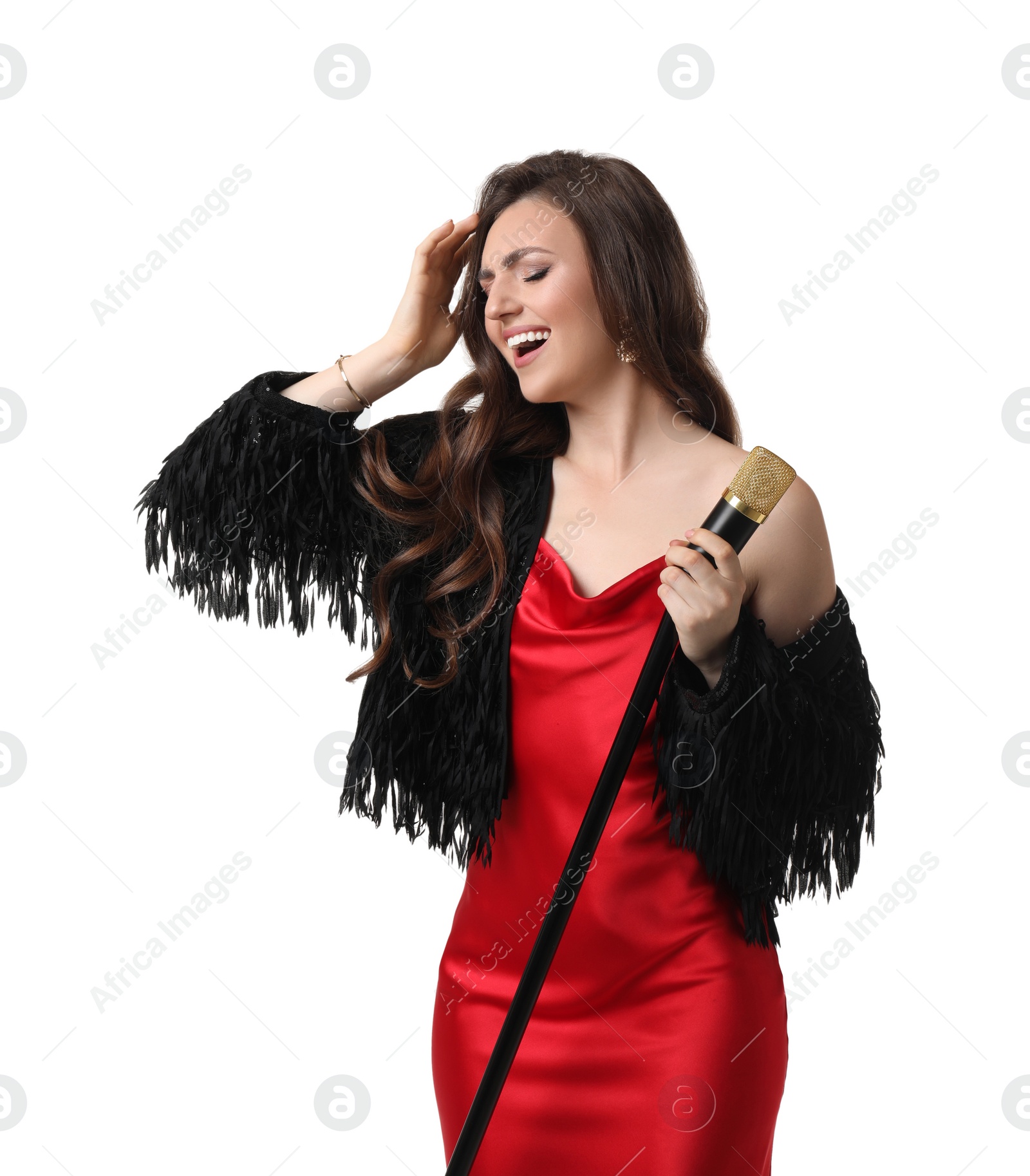 Photo of Beautiful young woman in stylish red dress with microphone singing on white background