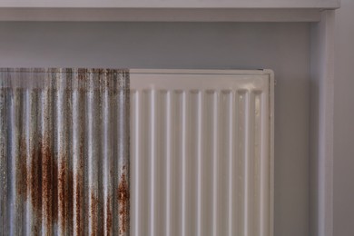 Image of Panel radiator affected by rust indoors, collage