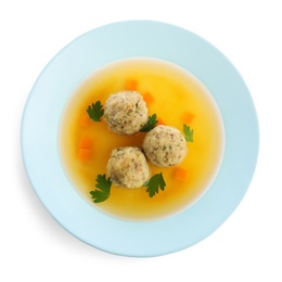 Photo of Dish of Jewish matzoh balls soup isolated on white, top view