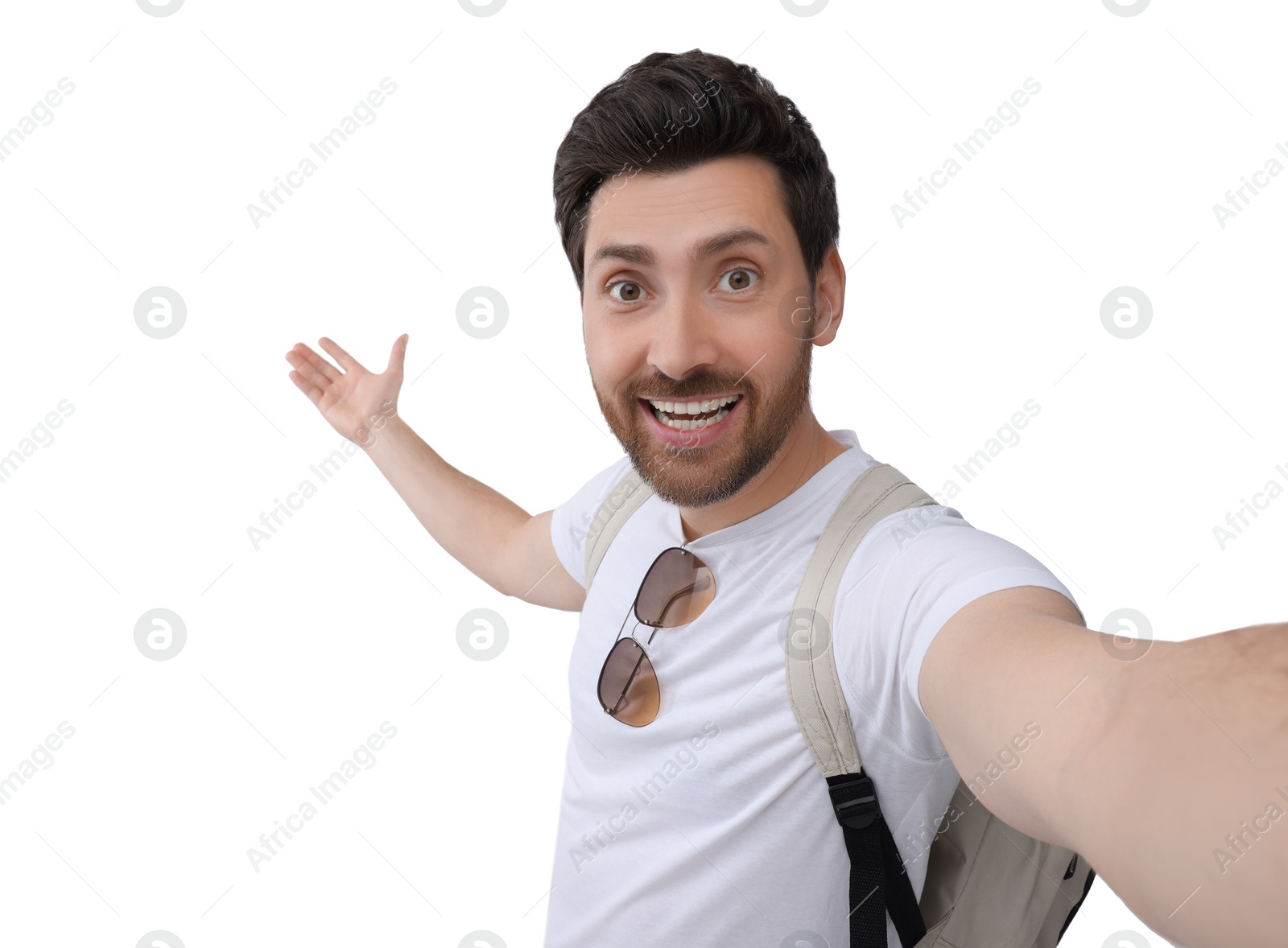 Photo of Smiling man taking selfie on white background