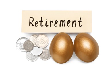 Photo of Golden eggs, coins and card with word Retirement on white background, top view. Pension concept