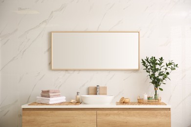 Photo of Modern bathroom interior with stylish mirror and vessel sink