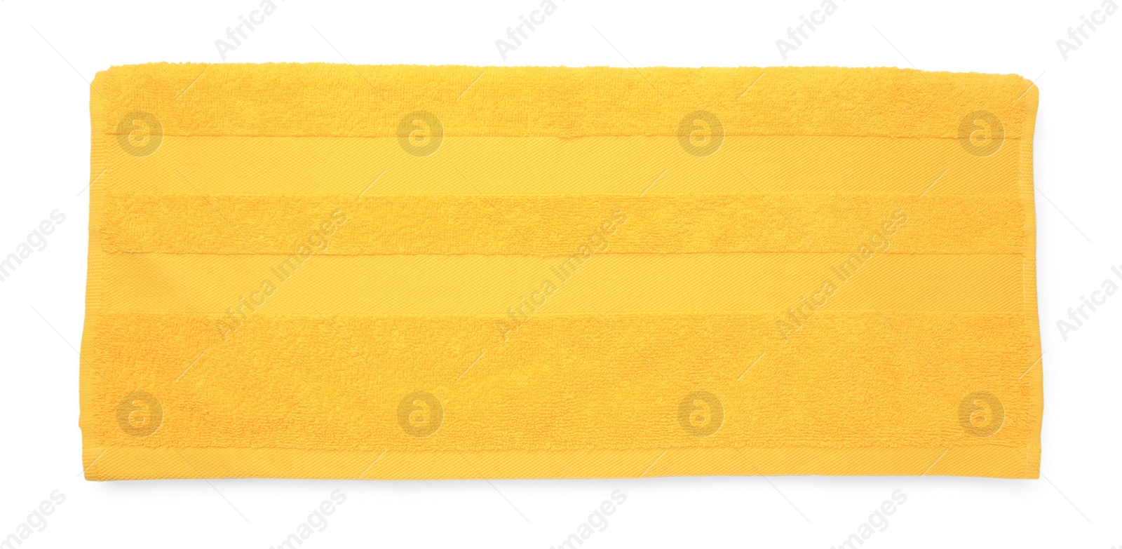 Photo of Soft yellow terry towel isolated on white, top view