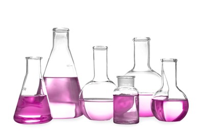 Image of Laboratory glassware with pink liquid isolated on white