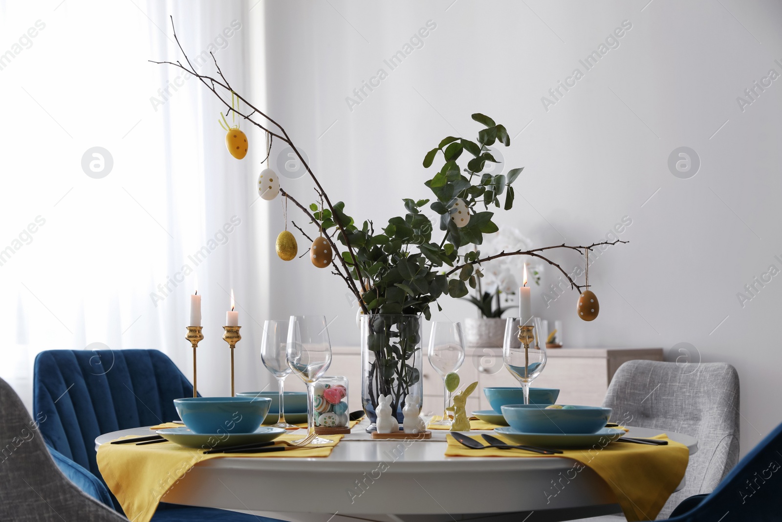 Photo of Beautiful Easter table setting with festive decor indoors