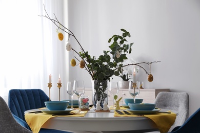 Beautiful Easter table setting with festive decor indoors