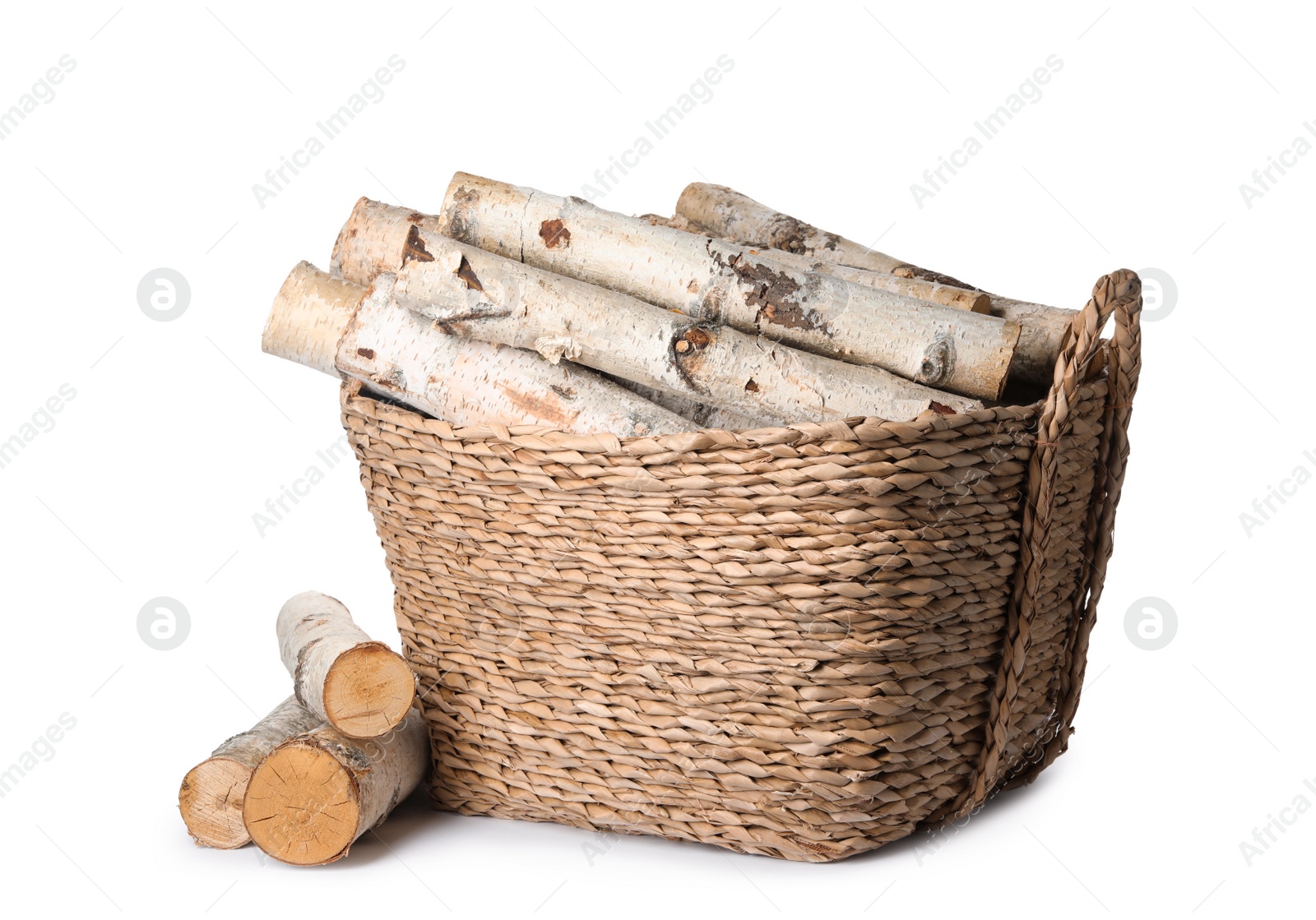 Photo of Wicker basket with cut firewood isolated on white