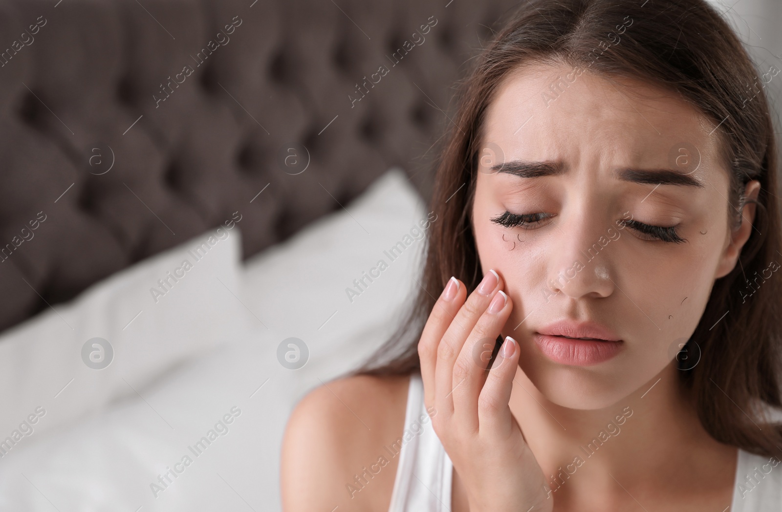 Photo of Young woman with eyelash loss problem indoors