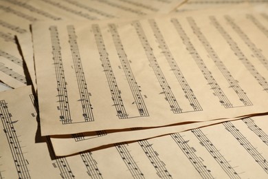 Photo of Many old note sheets as background, closeup