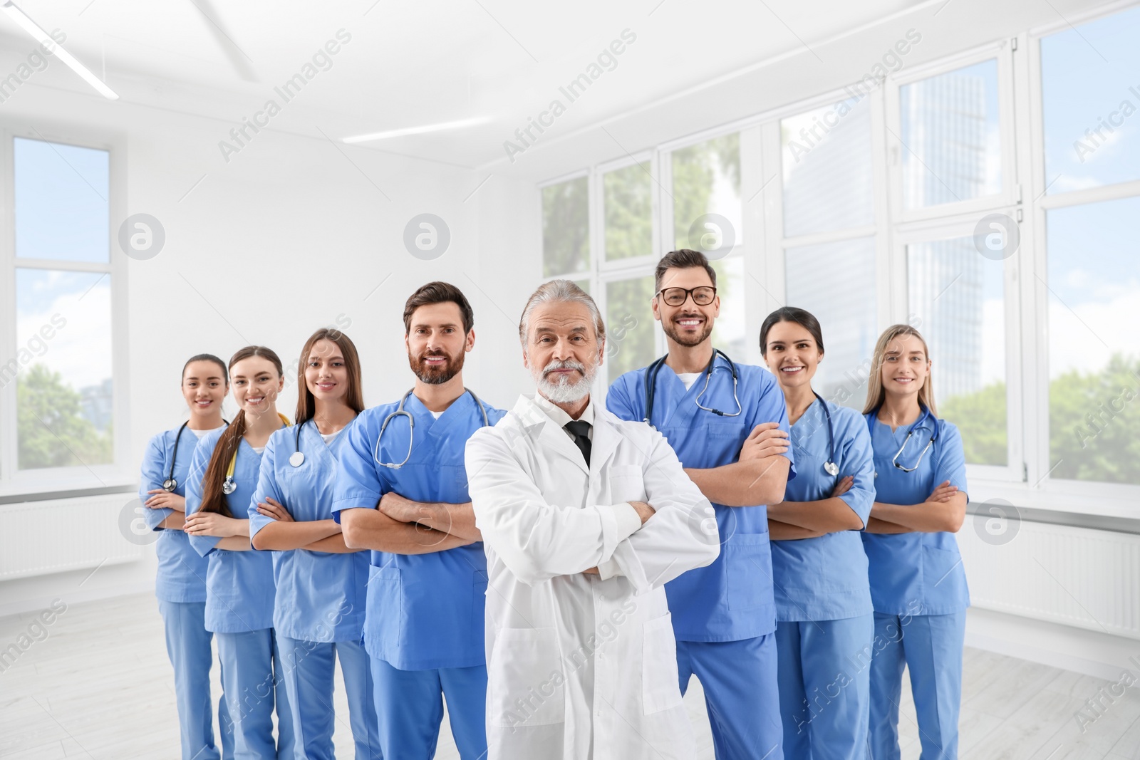 Photo of Doctor and his colleagues in hospital. Medical service