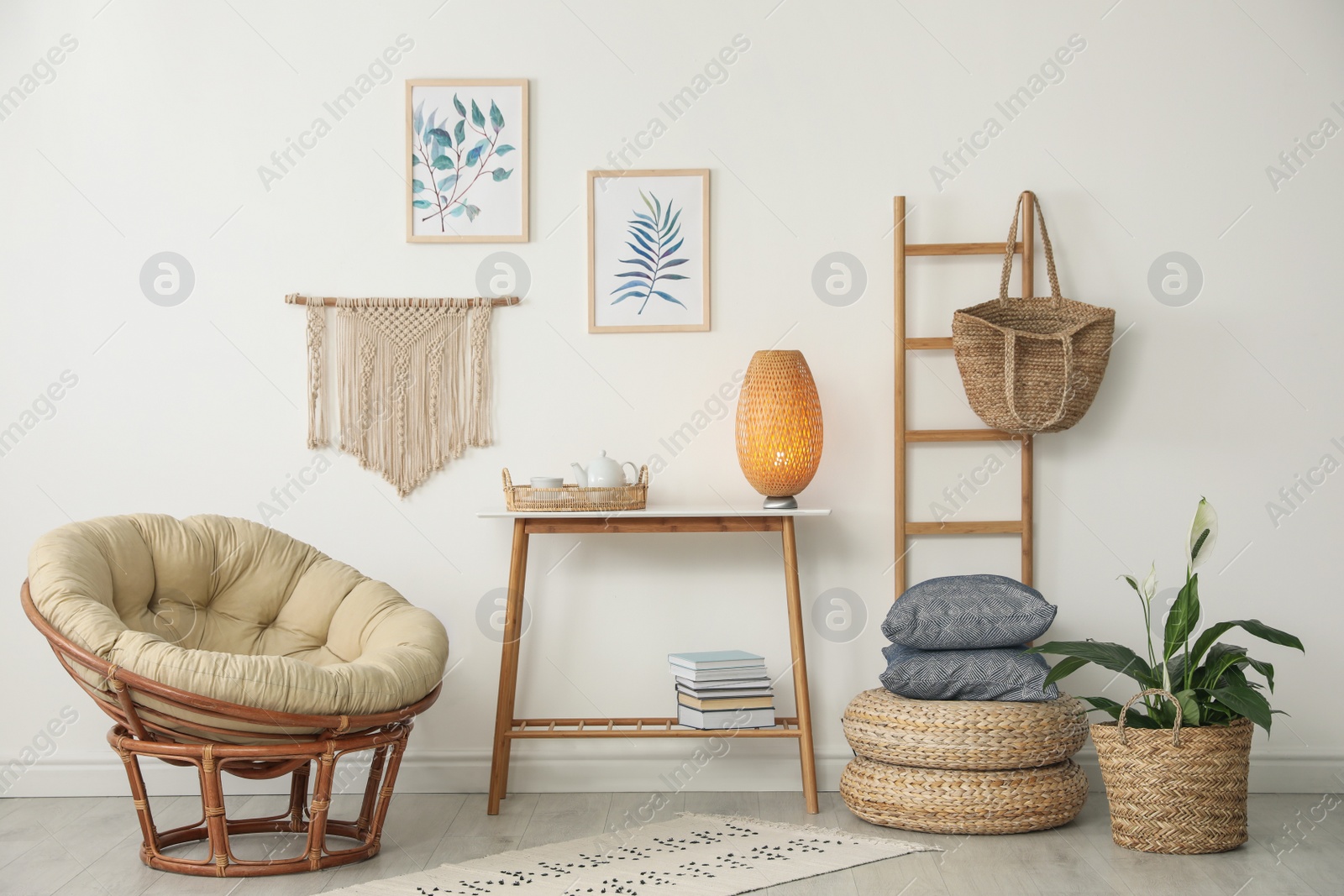 Photo of Living room interior design with comfortable papasan chair and wooden table