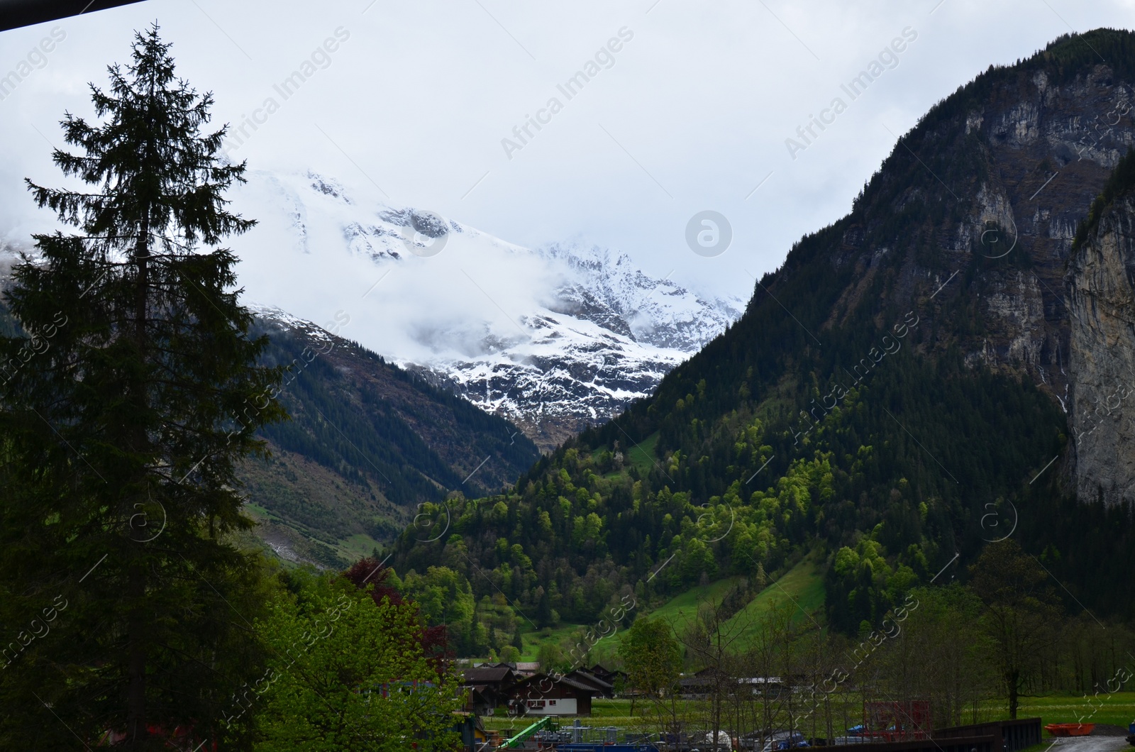 Photo of Picturesque view of mountain landscape with forest and village