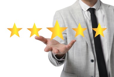 Image of Quality evaluation. Businessman showing virtual golden stars on white background, closeup