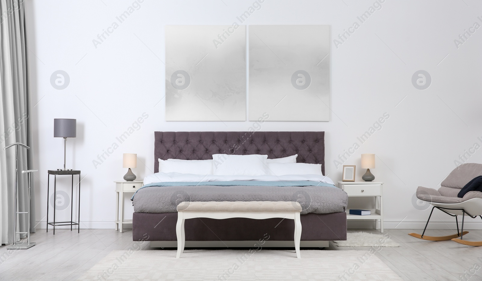 Photo of Stylish room interior with large comfortable bed