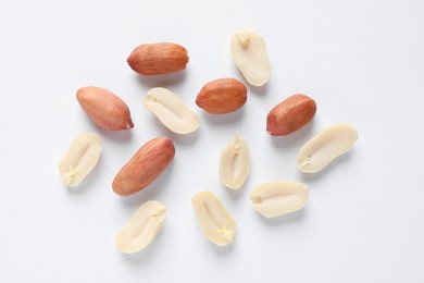 Photo of Fresh peanuts on white background, flat lay