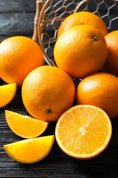 Fresh ripe oranges on wooden background. Citrus fruits