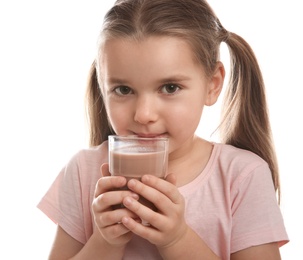 Cute little child with glass of tasty chocolate milk on white background, closeup