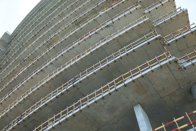 Construction site with unfinished building, low angle view