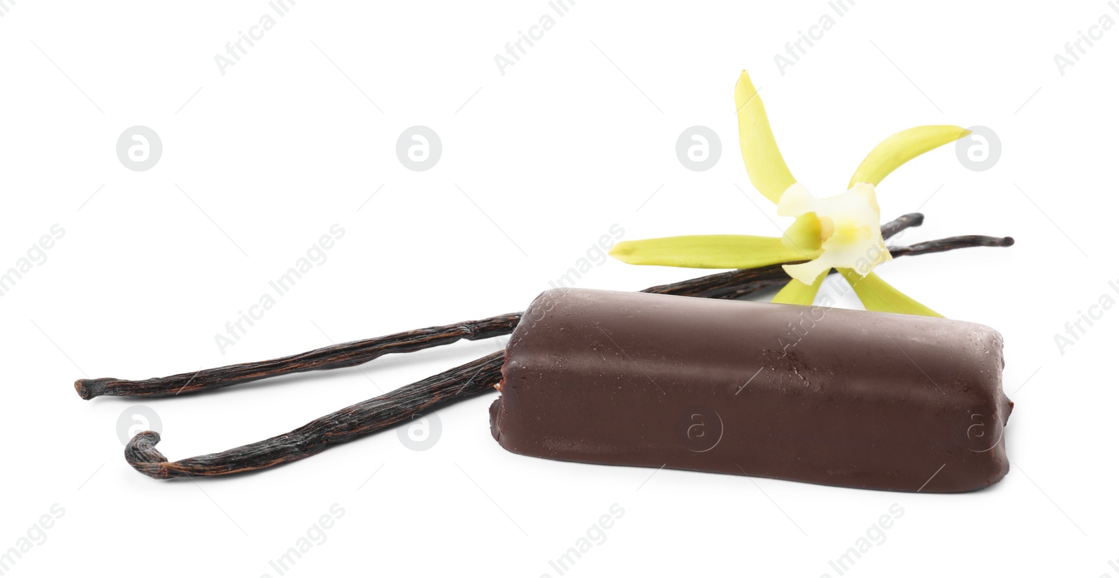 Photo of Glazed curd cheese bar, vanilla pods and flower isolated on white