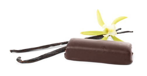 Photo of Glazed curd cheese bar, vanilla pods and flower isolated on white