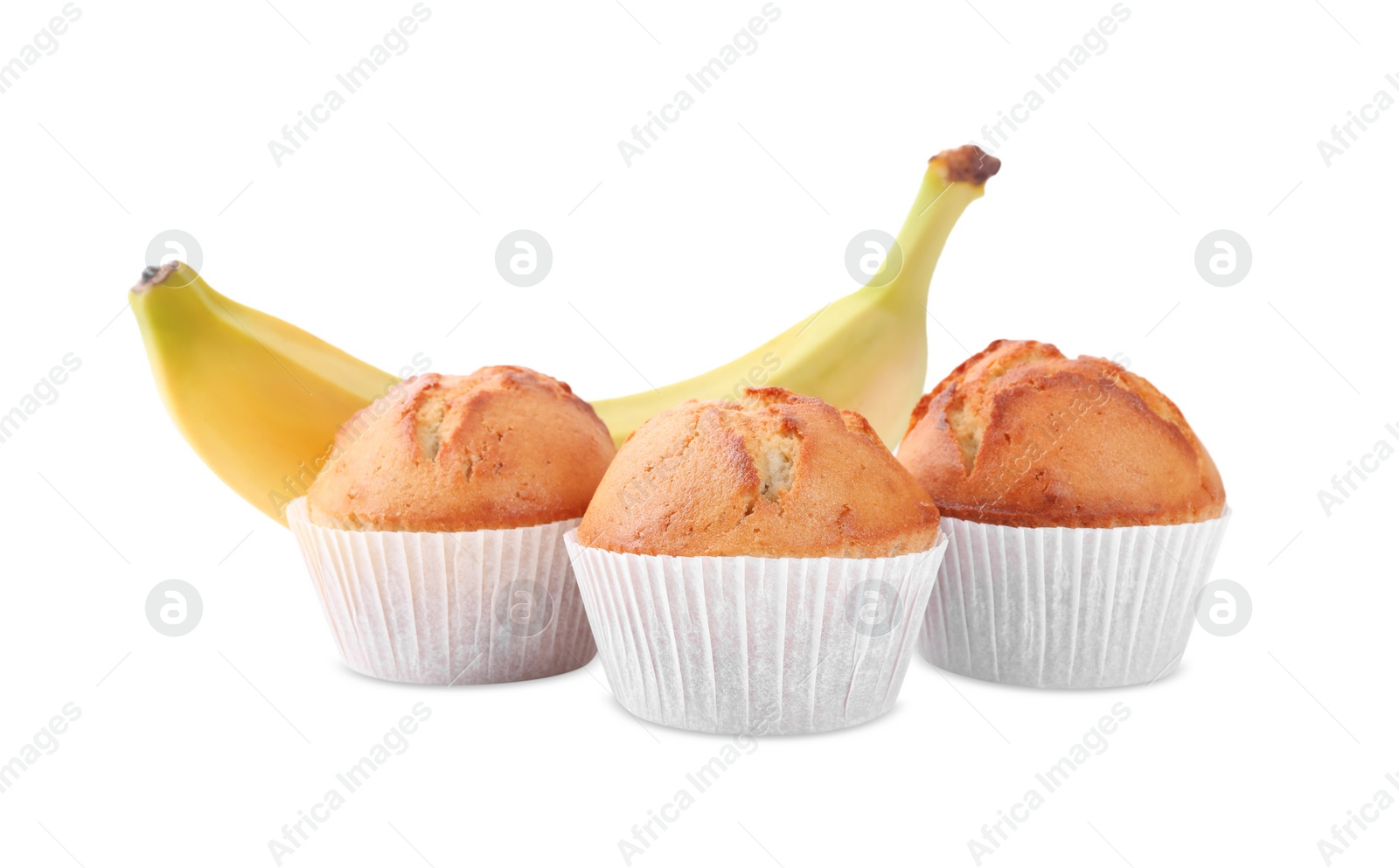 Photo of Tasty muffins and ripe banana on white background