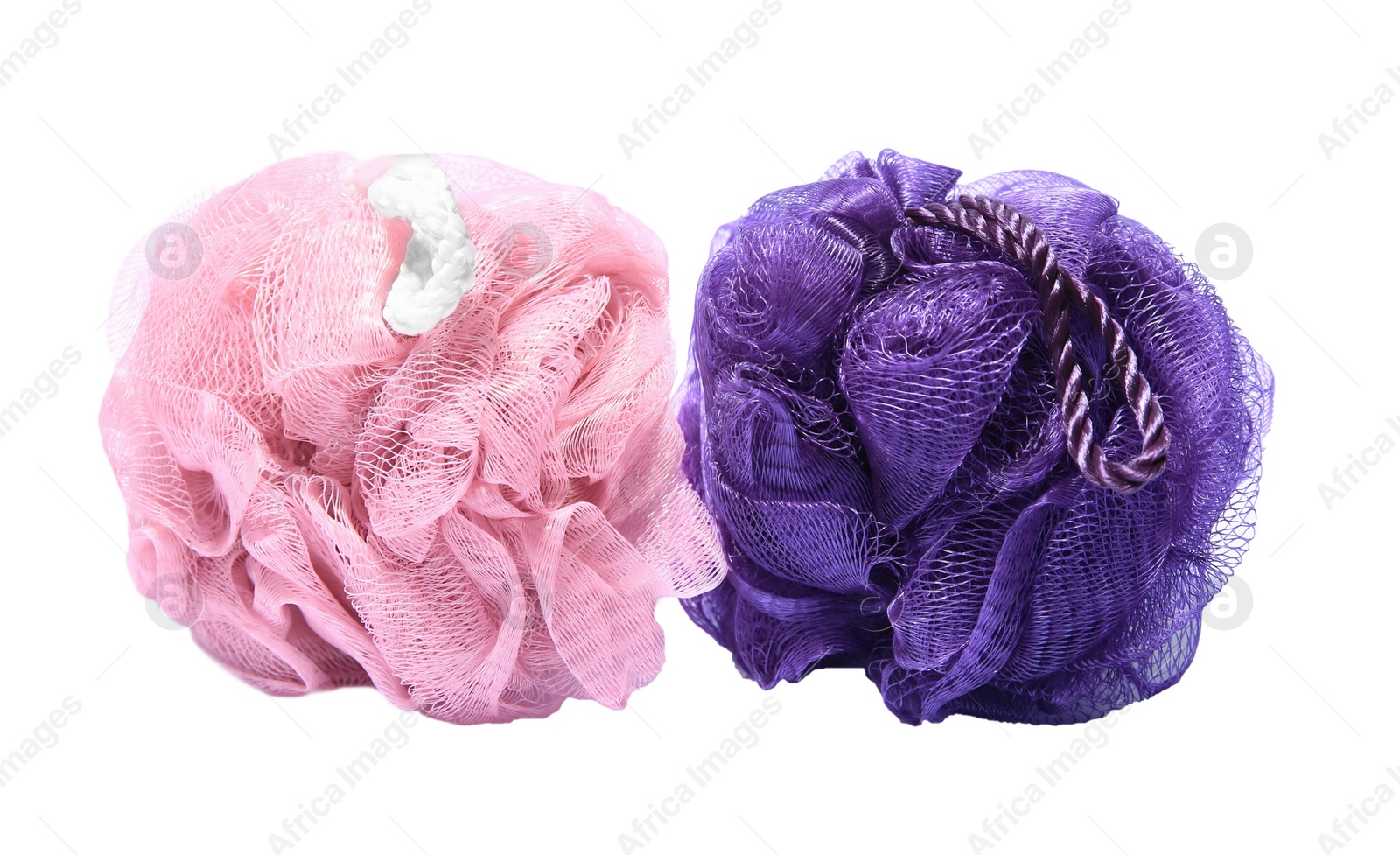 Photo of New shower puffs on white background. Personal hygiene