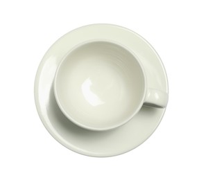 Photo of Ceramic cup with saucer isolated on white, top view