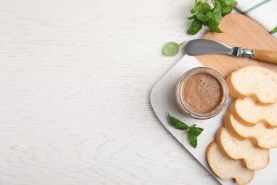 Photo of Delicious meat pate, fresh bread, knife and basil on white wooden table, flat lay. Space for text