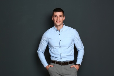 Photo of Portrait of handsome young man on dark background