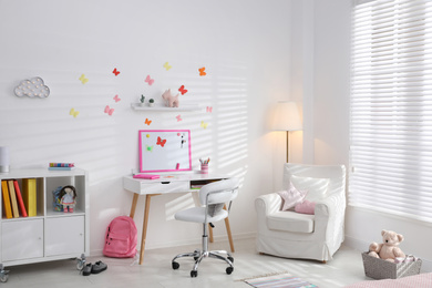 Photo of Modern child room interior with stylish furniture