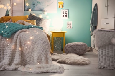 Photo of Cozy room interior with comfortable bed