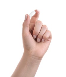 Photo of Woman holding vitamin pill on white background, closeup. Health supplement