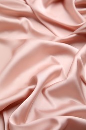 Photo of Texture of delicate pink silk as background, closeup