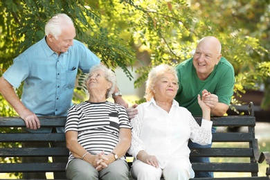 Photo of Elderly people spending time together in park