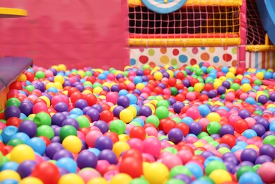 Photo of Ball pit with many colorful balls in play room