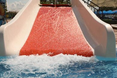 Photo of Wide slide at water park. Summer vacation