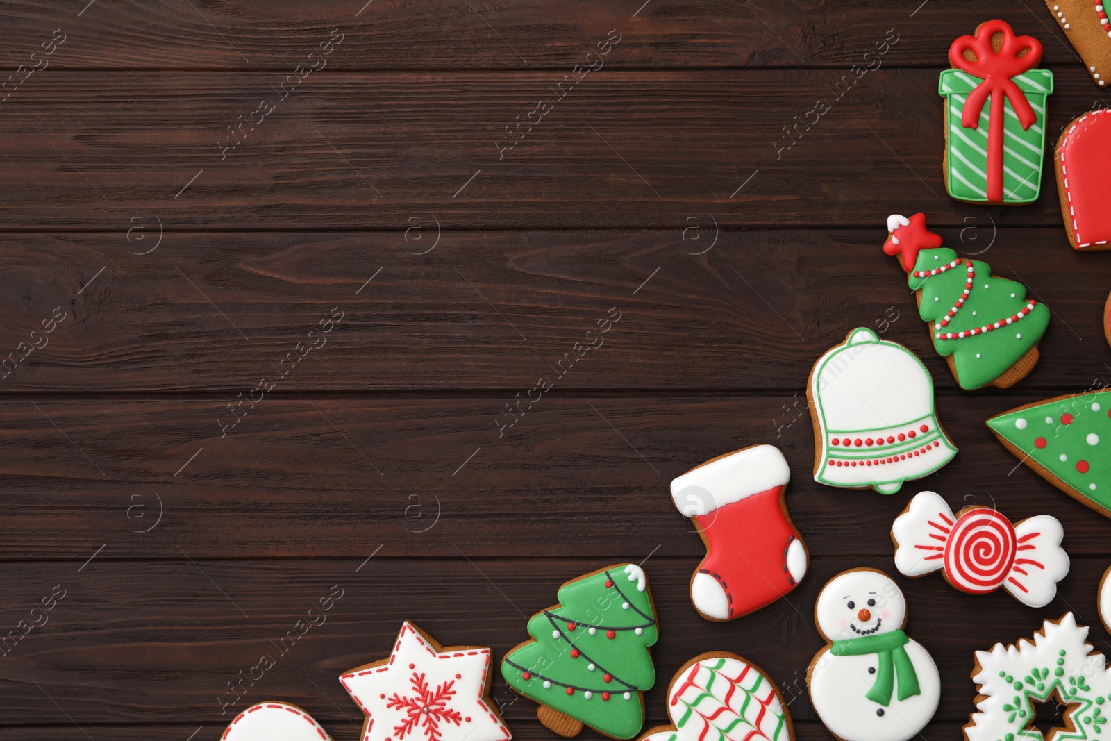 Photo of Many different delicious Christmas cookies on wooden table, flat lay. Space for text
