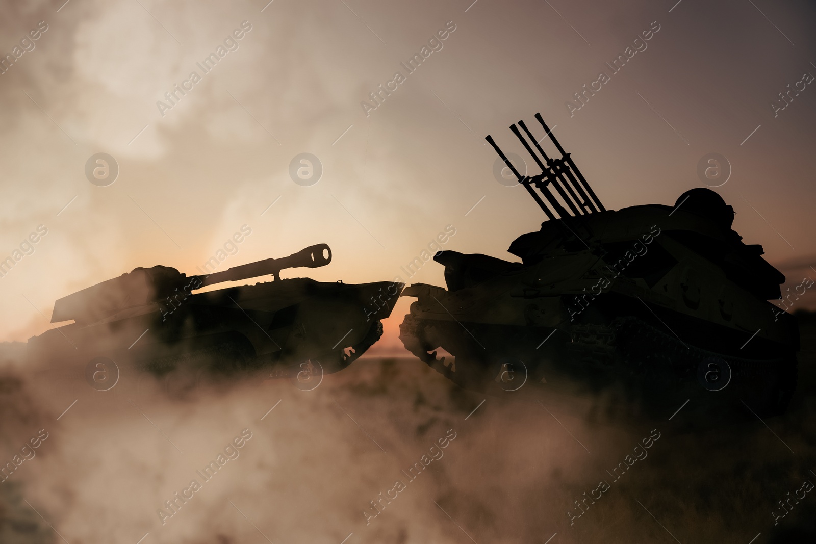 Image of Silhouettes of armored fighting vehicle and tank on battlefield