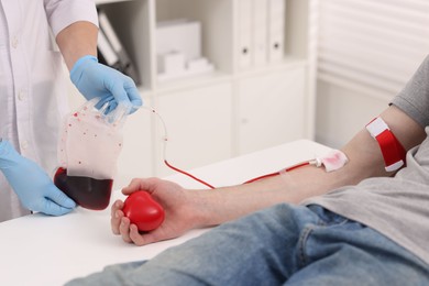 Photo of Patient undergoing blood transfusion in hospital, closeup